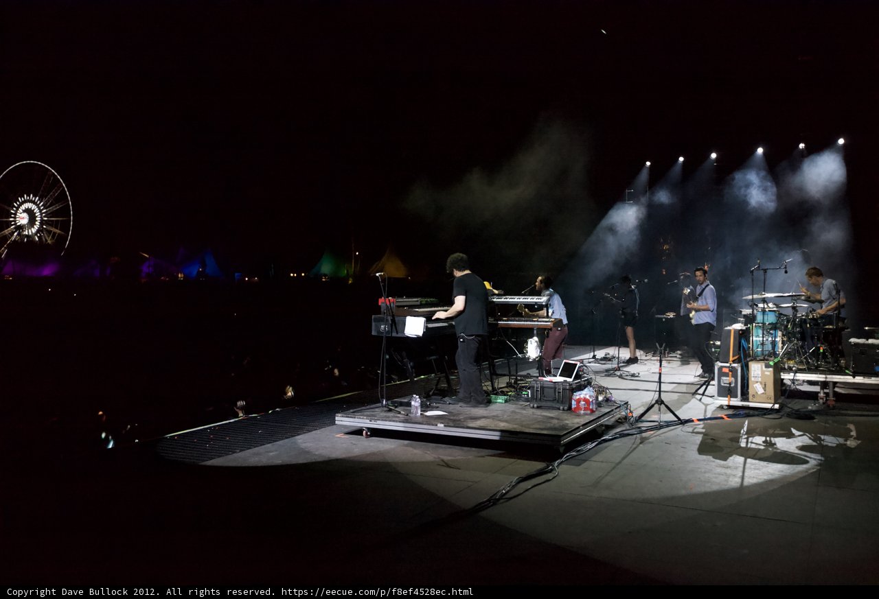 Nighttime Concert with Ferris Wheel Backdrop