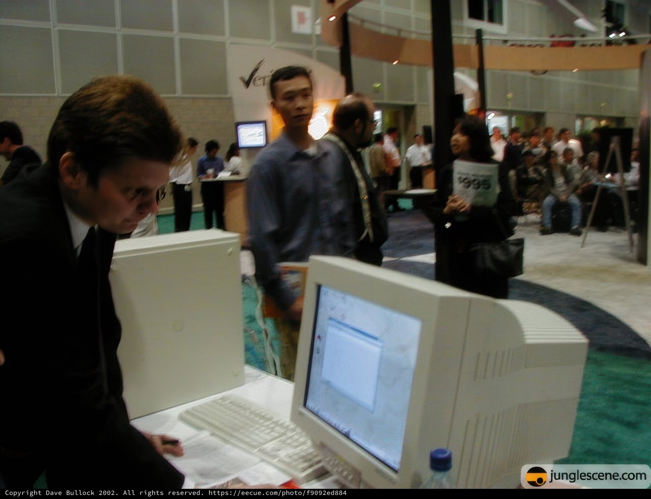 Elegant Man in Black Suit at Internet World 2002