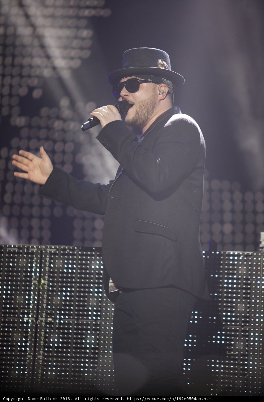 Solo Performance in Fedora Hat and Suit