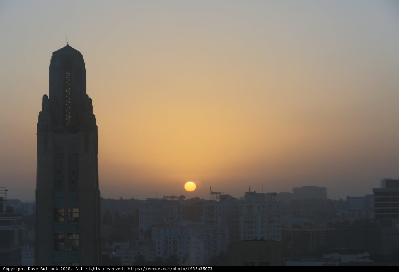 Urban Sunset Behind a Skyscraper