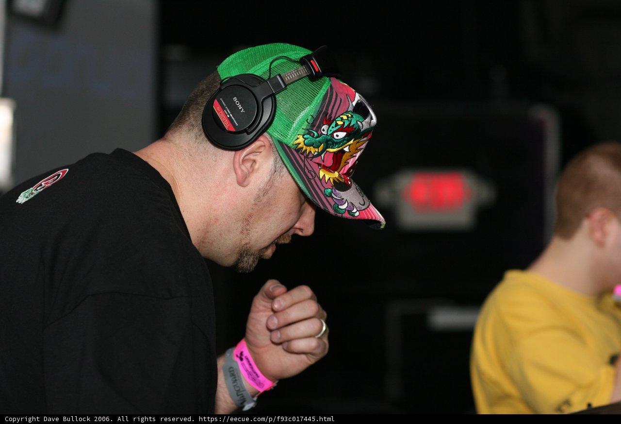 Hat-wearing man enjoying music