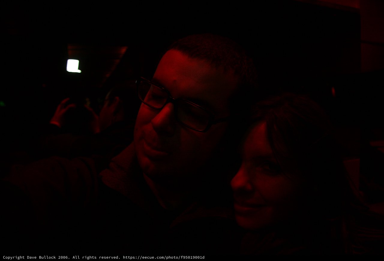 Red Light Revelers in Darkened Club Atmosphere