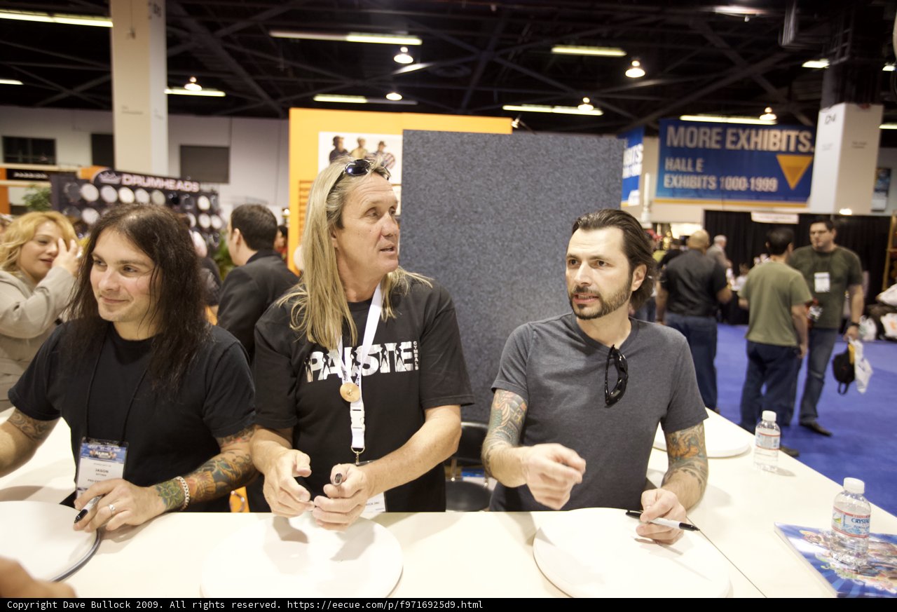 Three Men Chatting with a Microphone