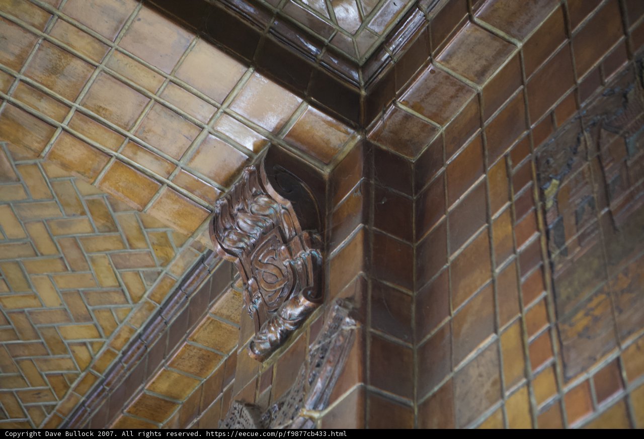 Corner of Building Adorned with Brown Tiles