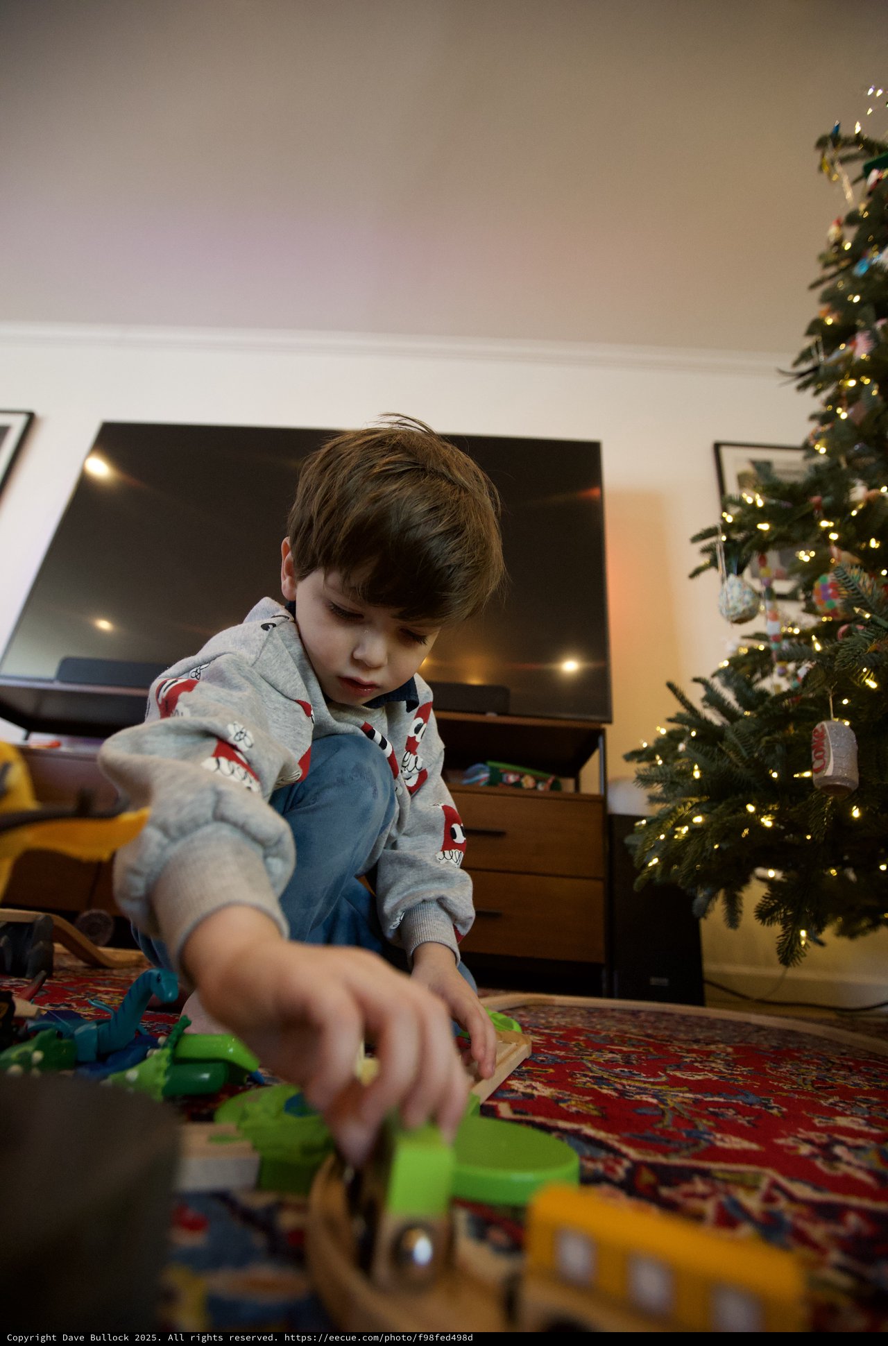 Christmas Morning: Boy Playing with New Toys