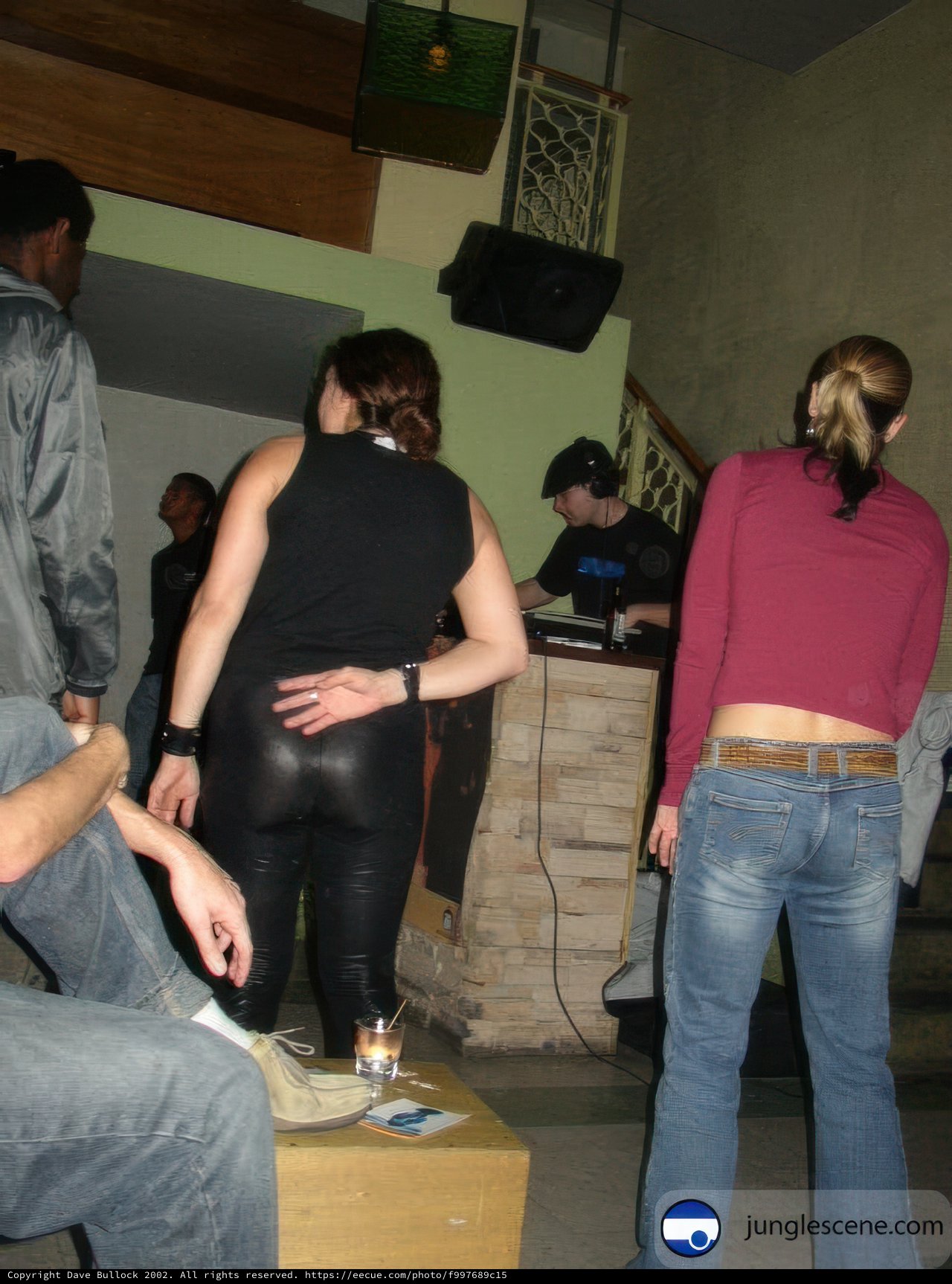 Group of 8 Listening to Music at Night Club