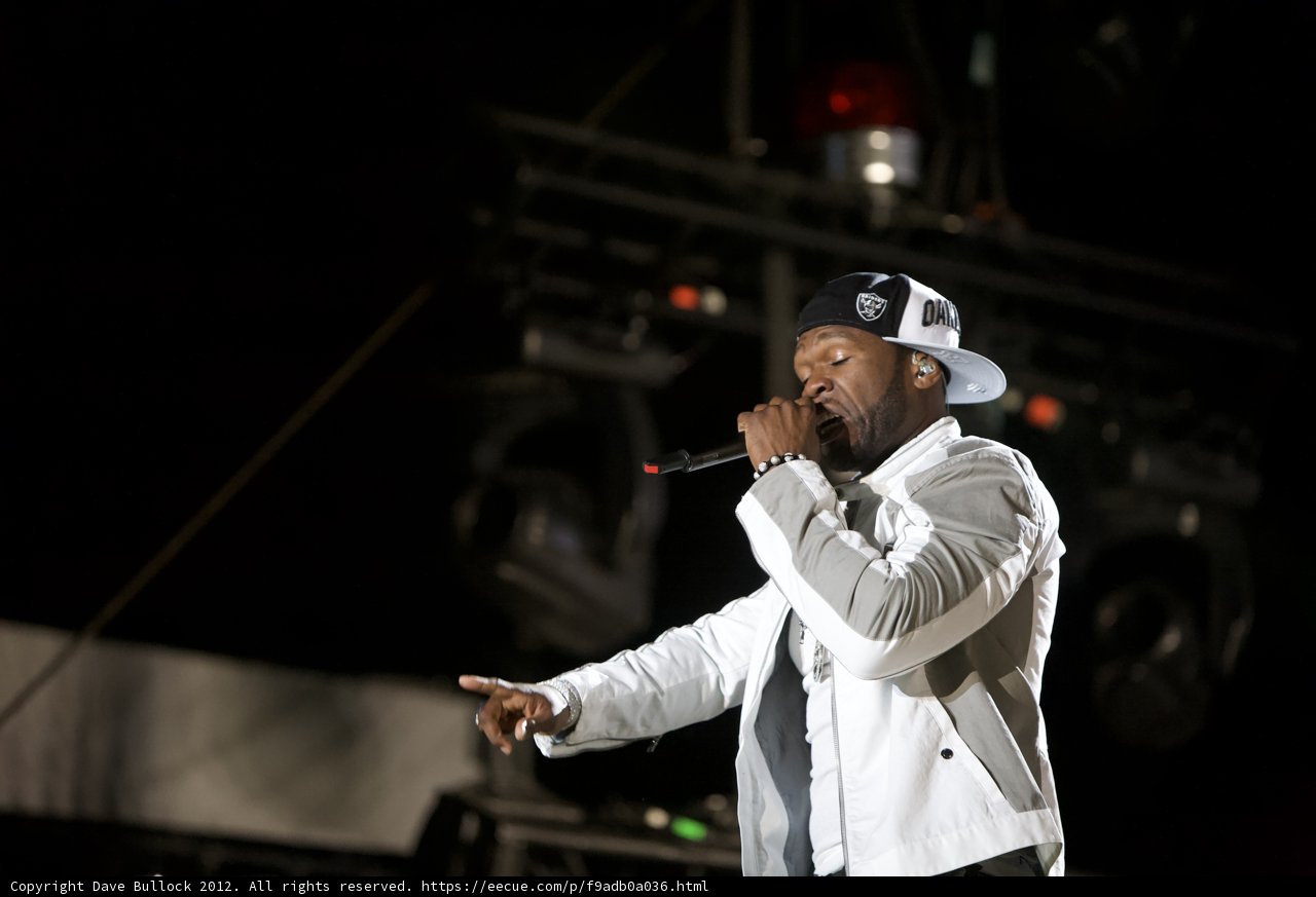 50 Cent Rocks the Stage in a White Jacket and Hat