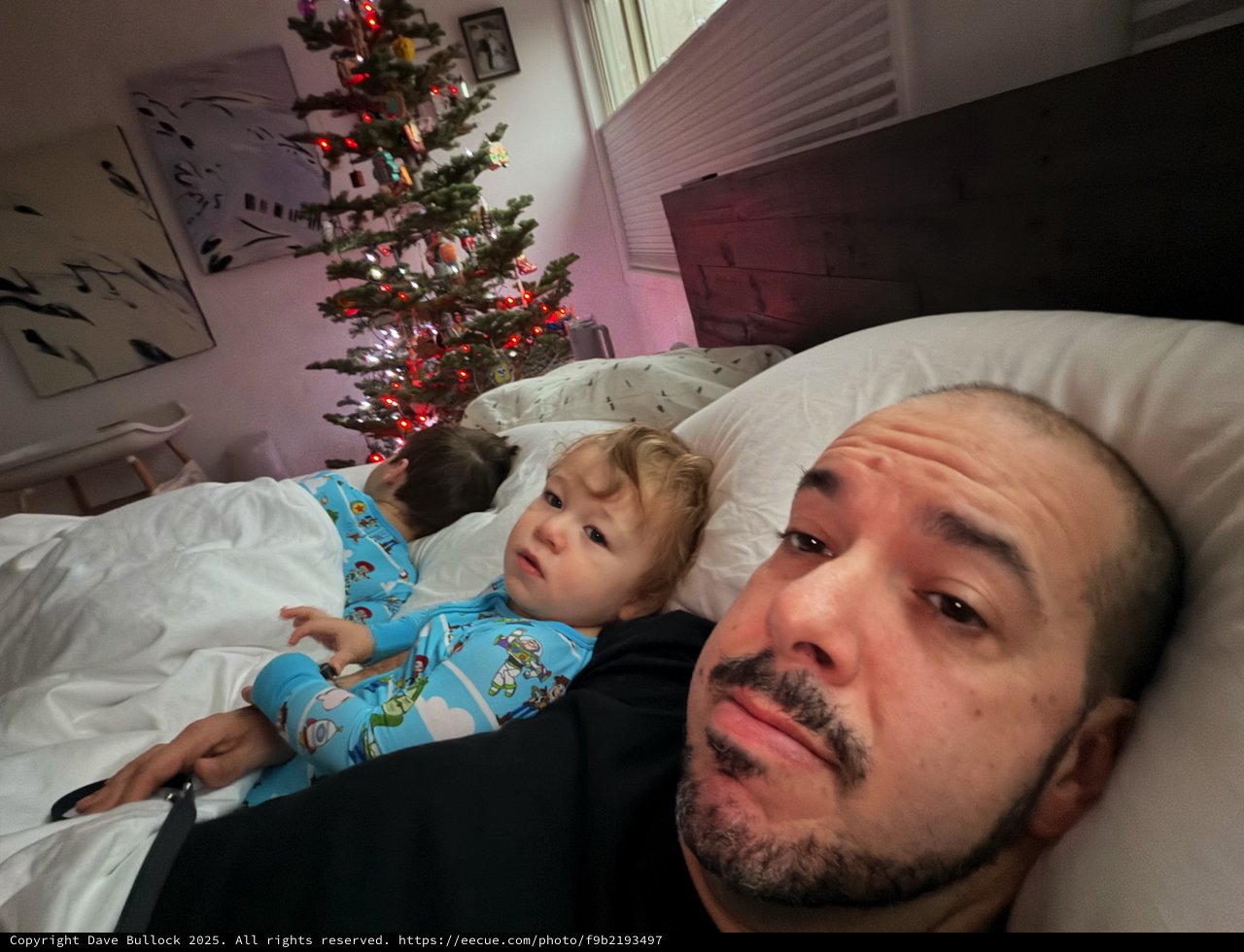 Father and Child Christmas Morning in Bedroom