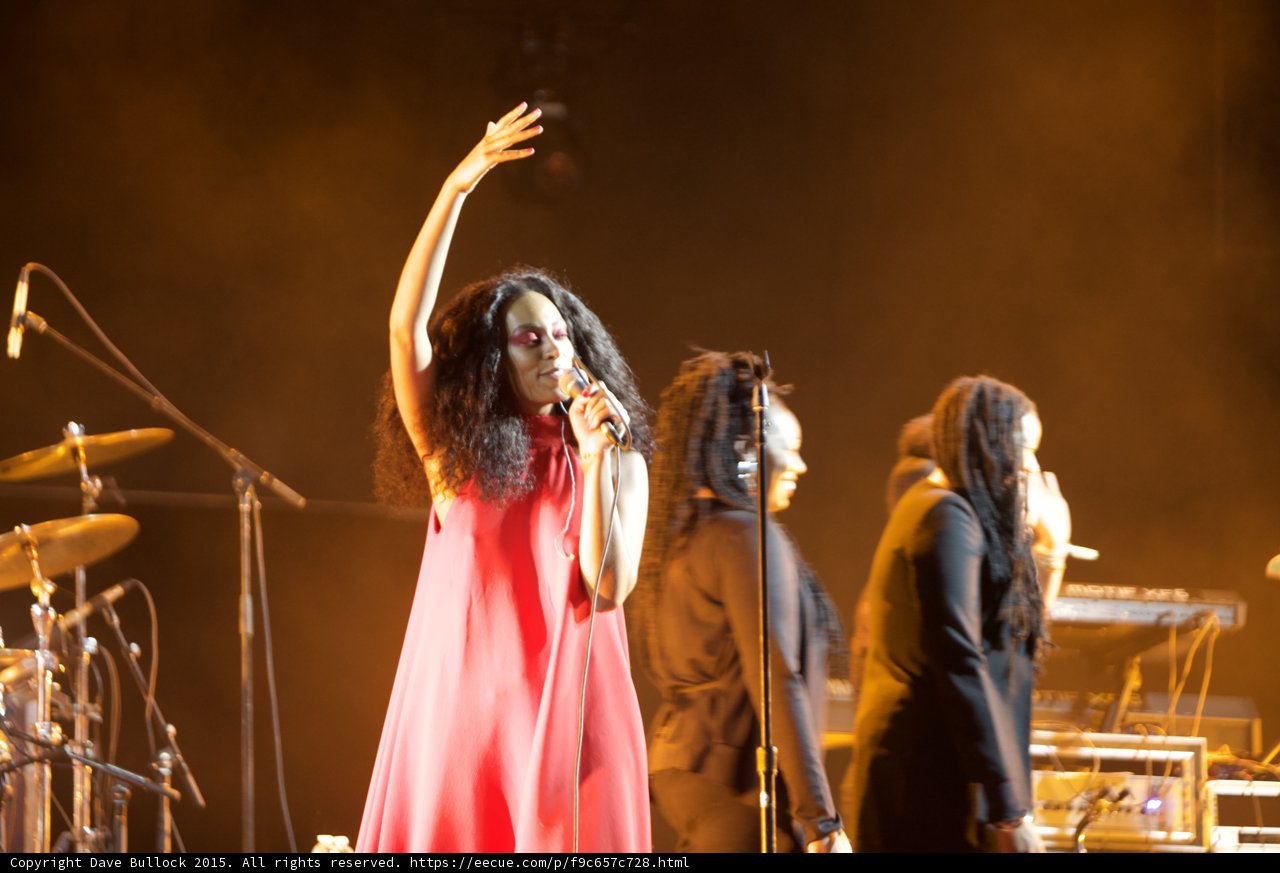Solange Waving Goodbye Red Dress Arm Raised Backing Vocalists Orange Golden Haze