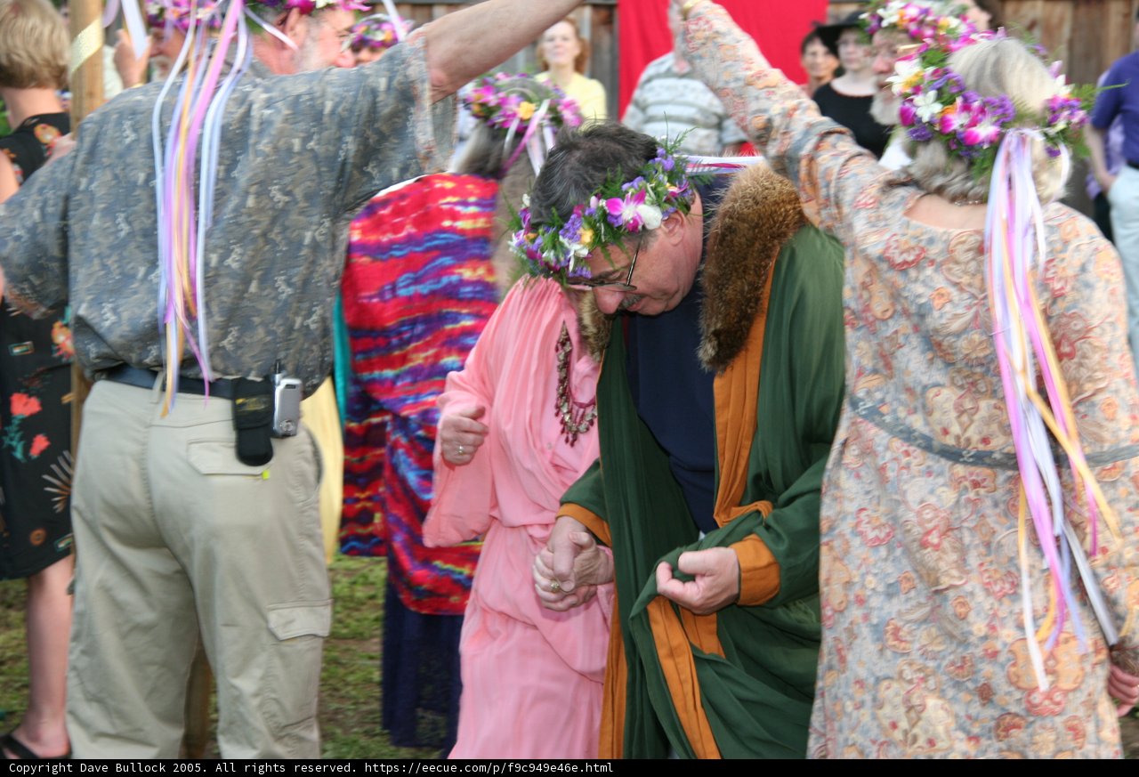 Green Shirted Man Holding a Flower Bouquet at a Wedding