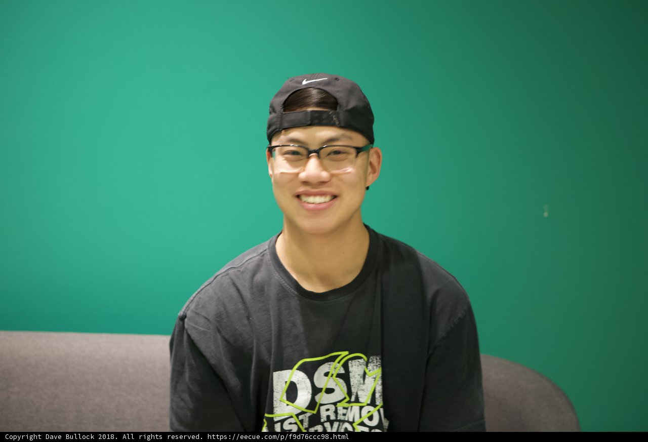 Smiling Teen in his Black Hat and Shirt