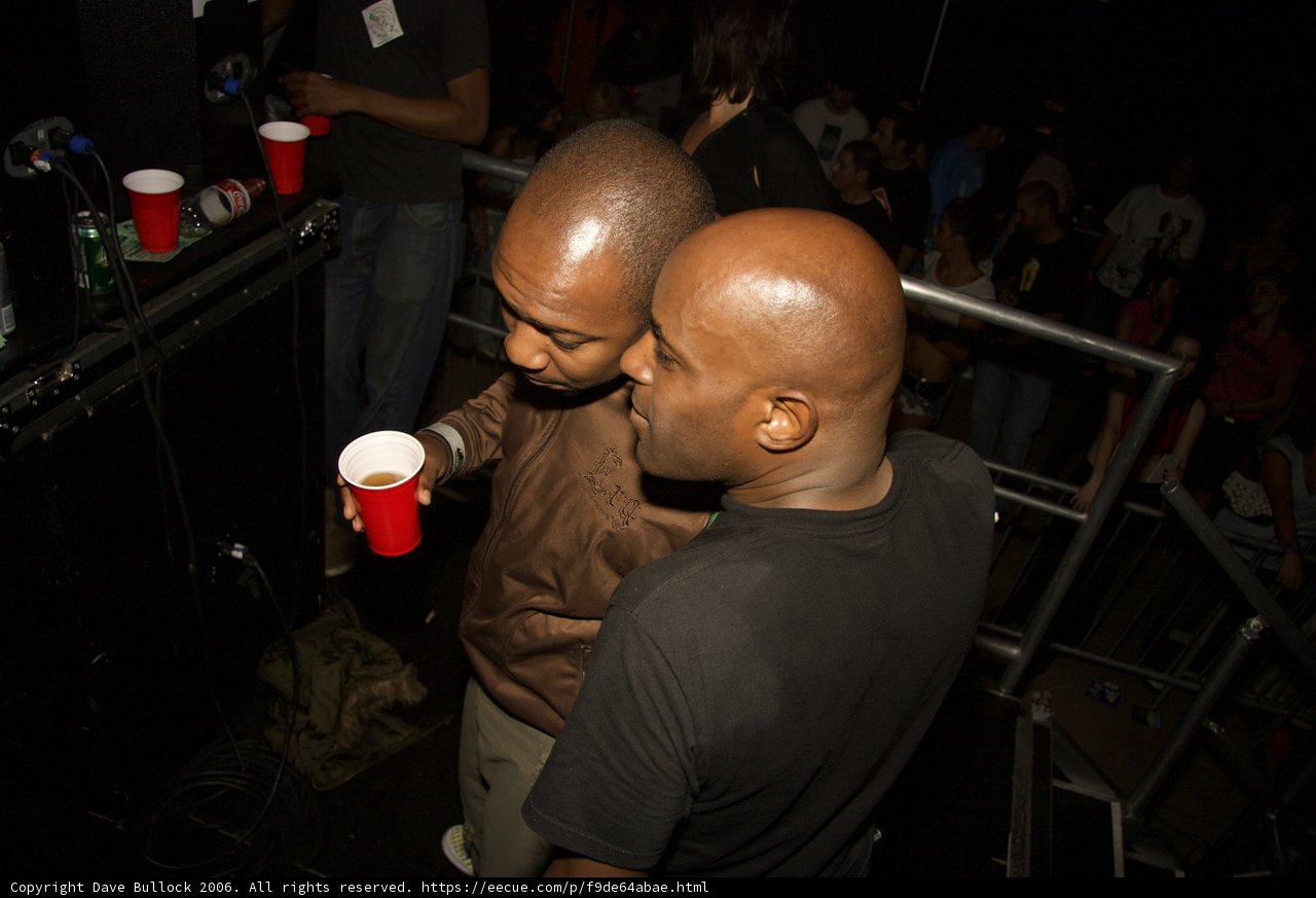Two Men Enjoying Nightlife at a Pub