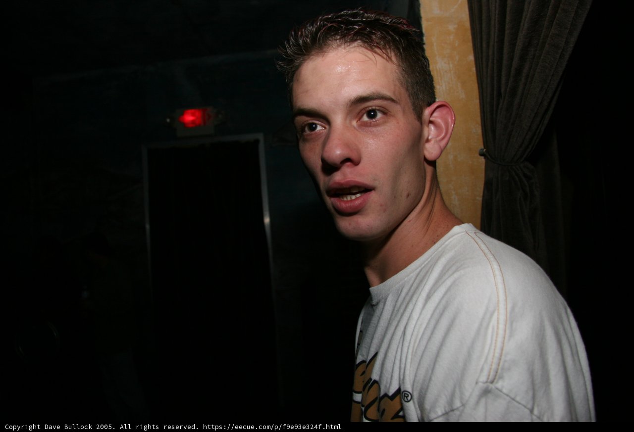 White-Shirted Man Smiling at the Camera