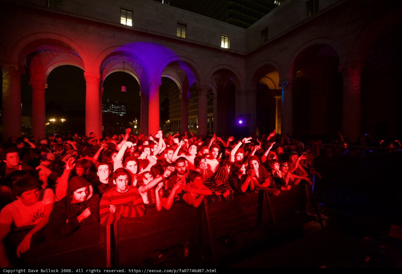 Katy Steele performs for a lively crowd under colorful lights
