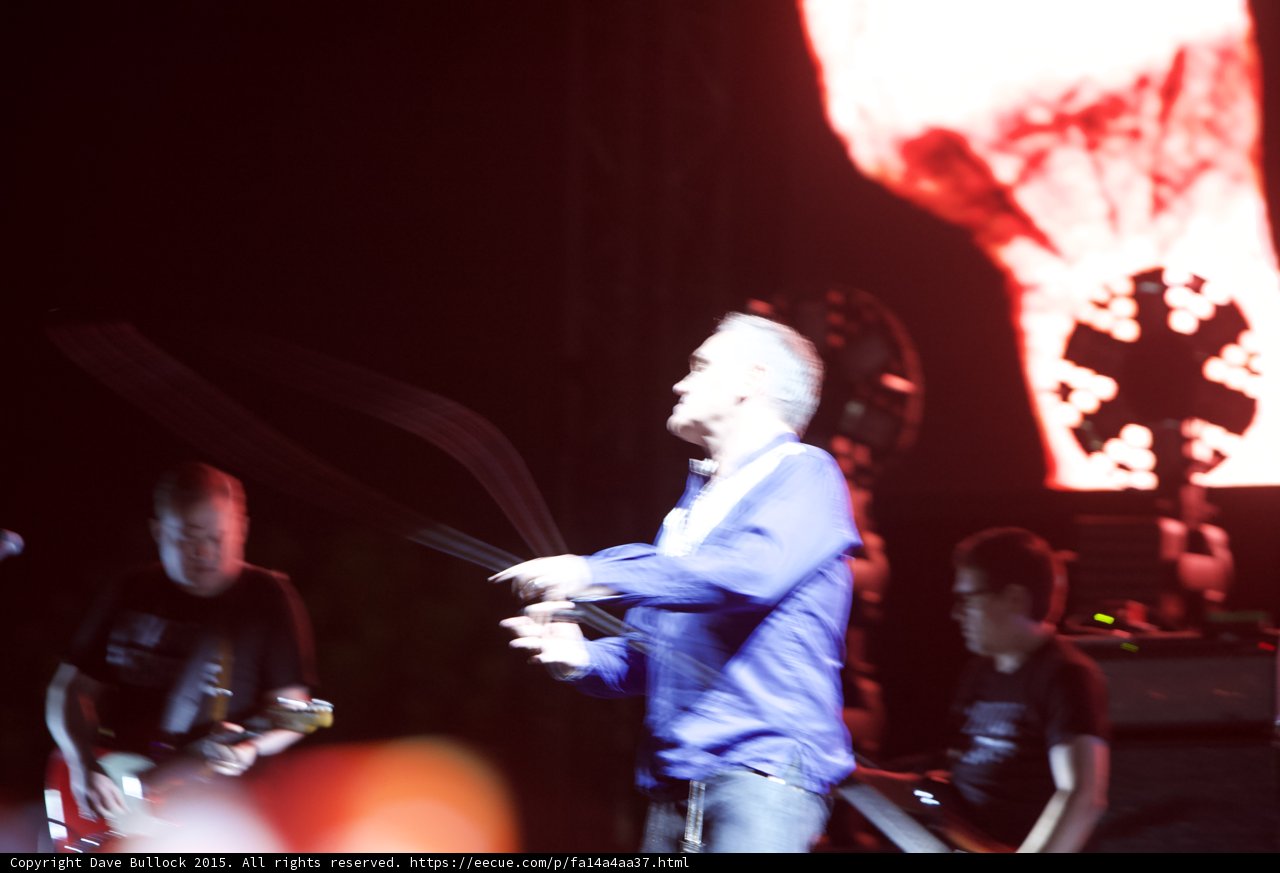 Morrissey Motion Blur Arms Gesturing Blue Shirt Guitarist Bassist Red Video Screen Circular Light