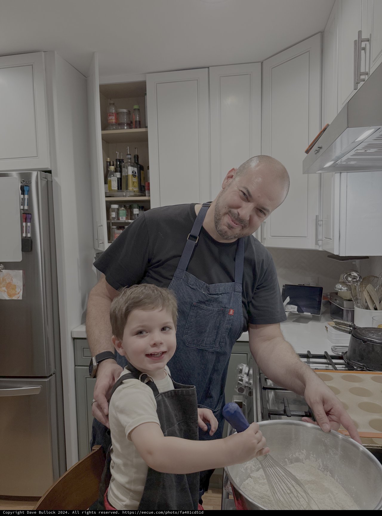 Father and Son Cooking Together in Kitchen