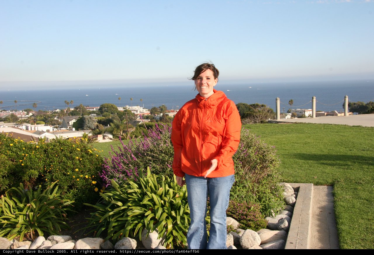 Woman in Orange Jacket at Coastal California Overlook