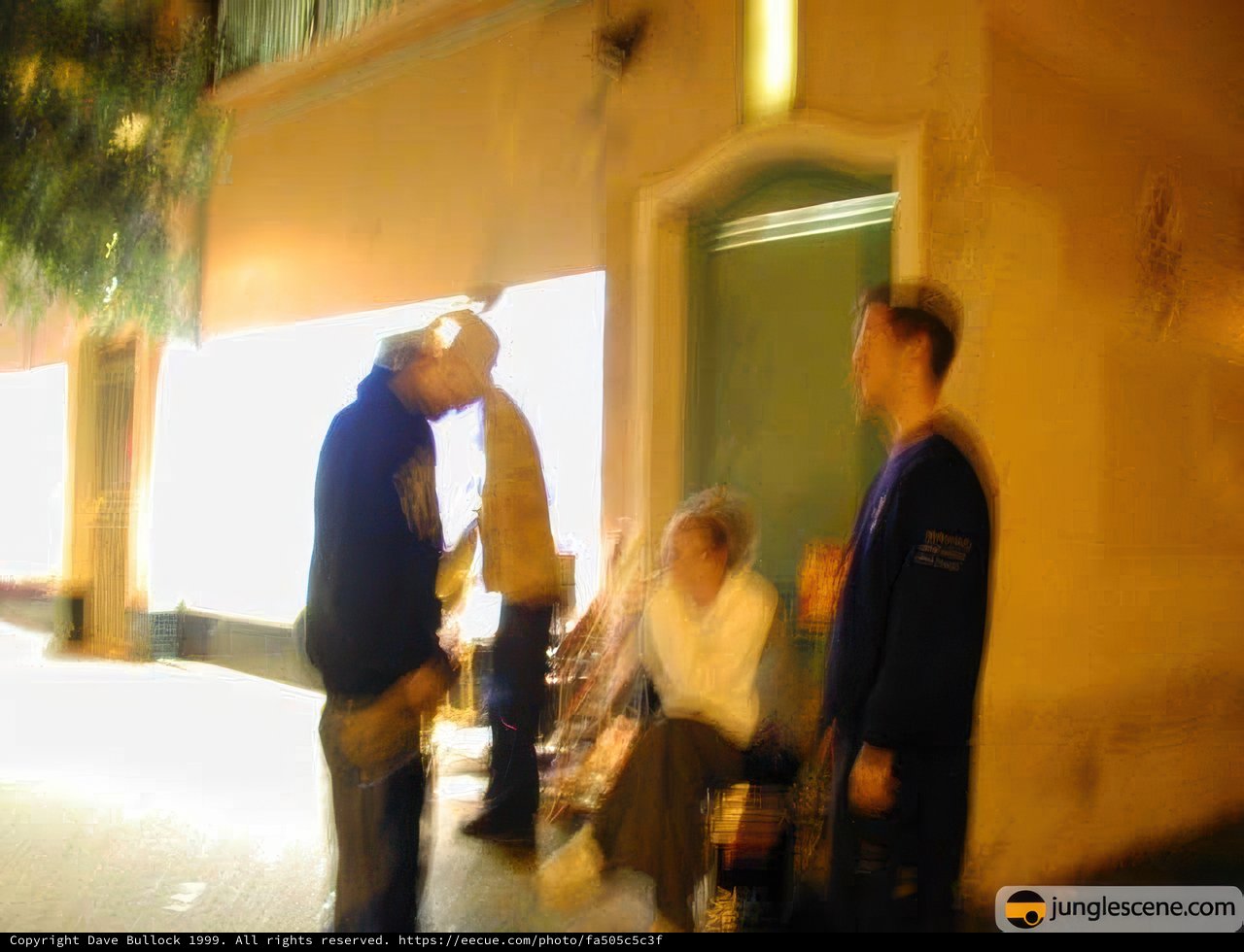 Blurred Silhouettes on the Urban Sidewalk