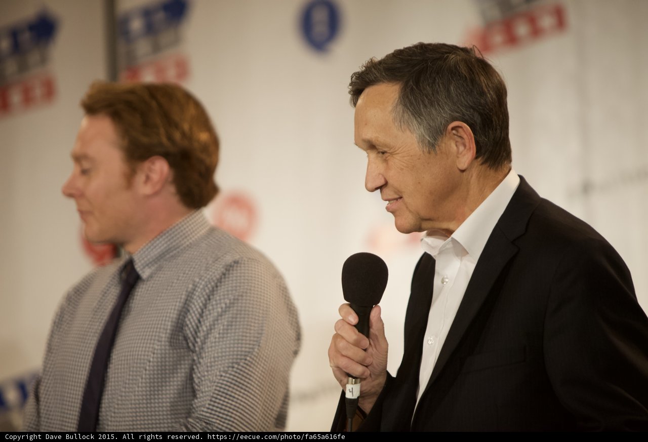 Two Men Speak to a Captivated Audience