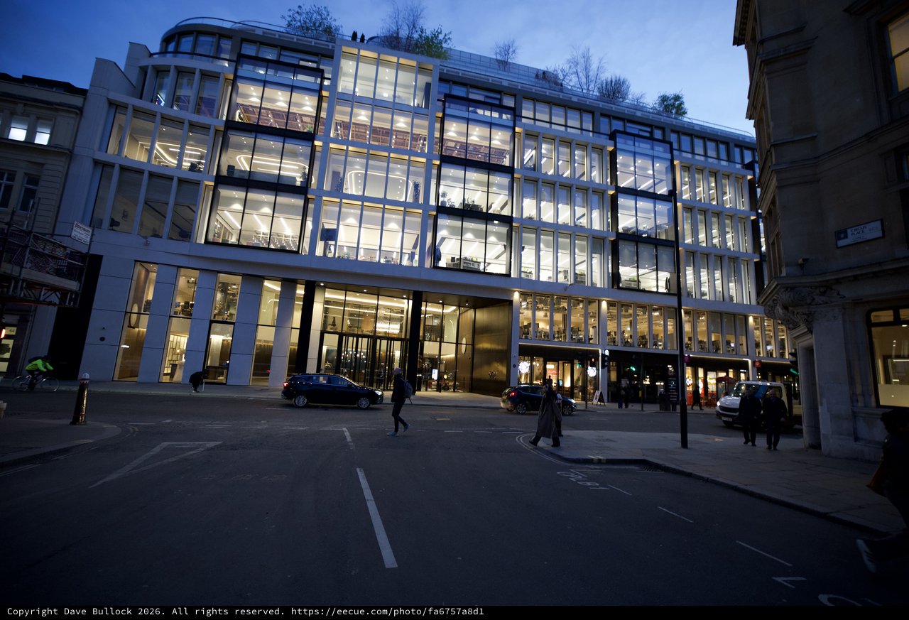 Modern Glass Office Building Illuminated at Dusk in London