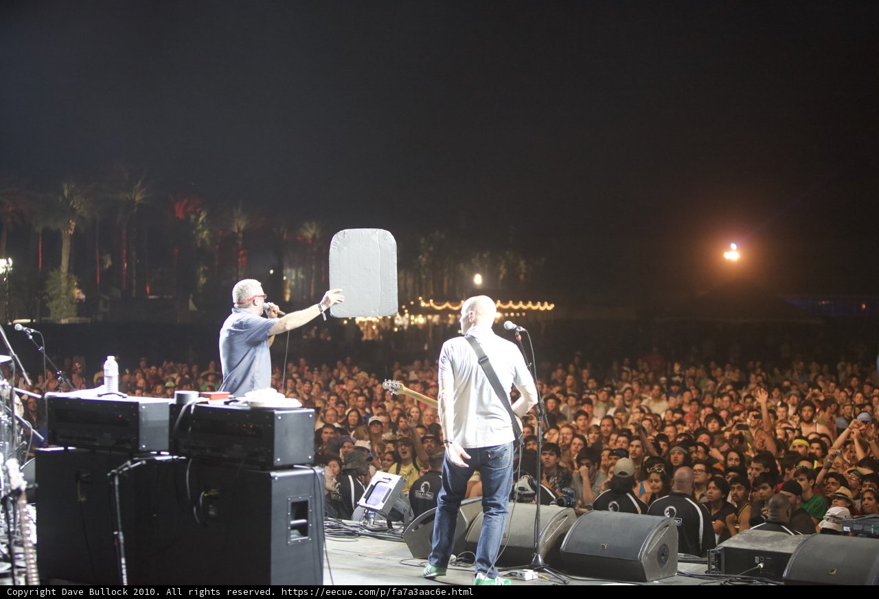 Two Men Rocking the Stage and the Huge Crowd Cheers