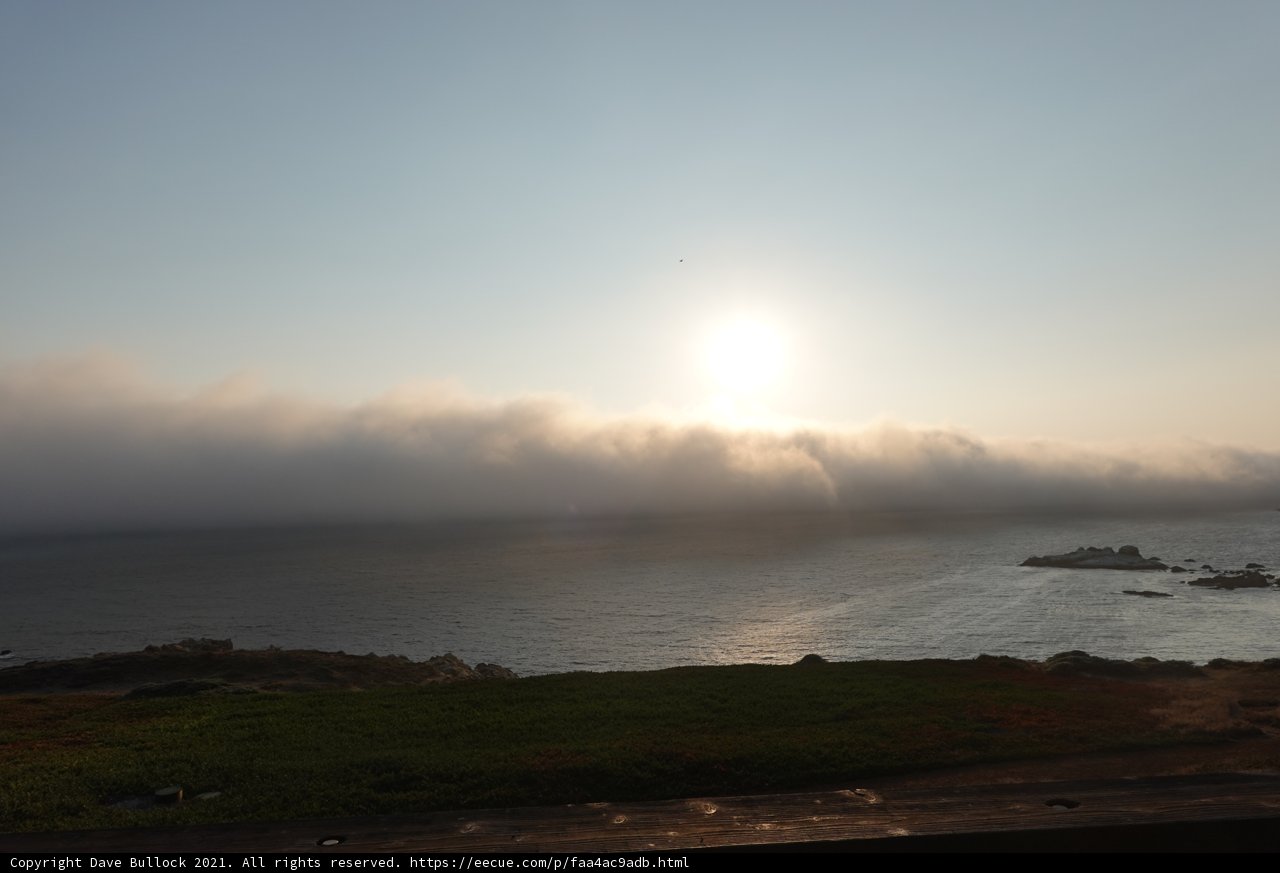 A beautiful sunrise over the foggy California coast