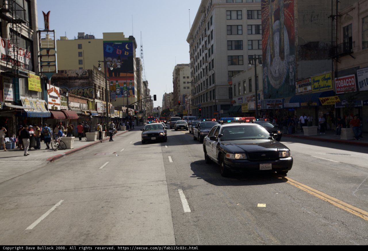 Police car in the midst of the bustling Metropolis