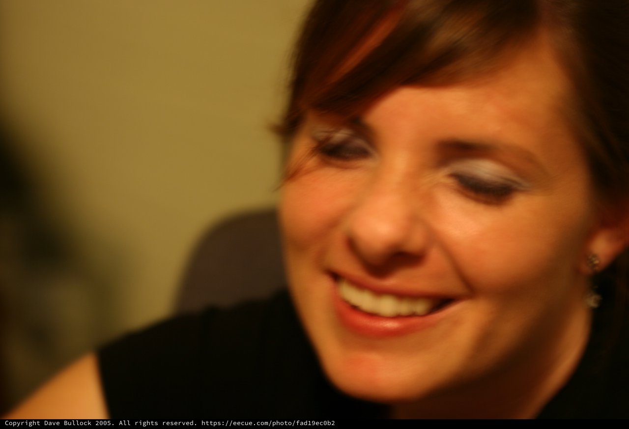 Candid Smile: Woman Lost in a Warm Moment