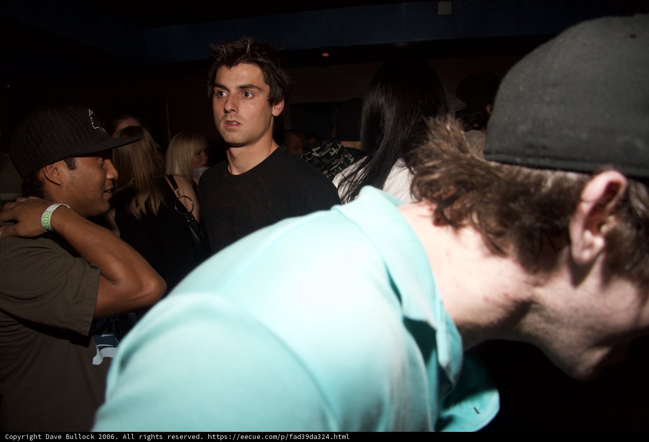 Man in Black Hat at Nightclub
