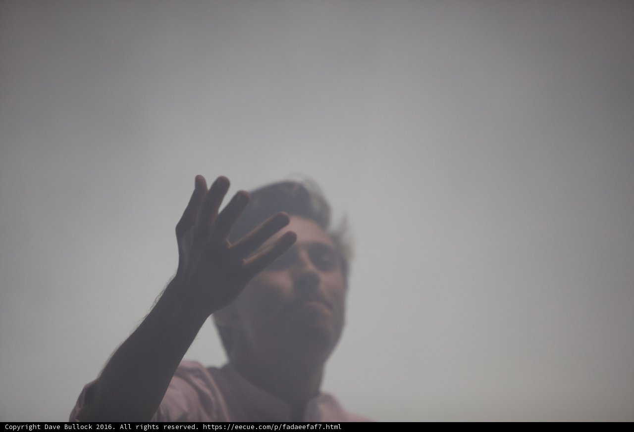 Pink Shirted Man in Prayer Pose