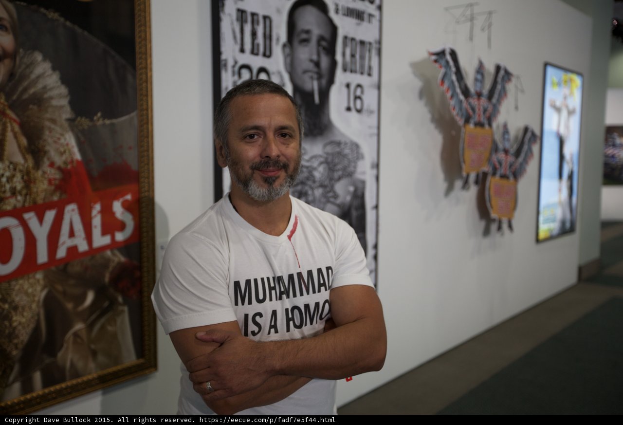 Ted Cruz posing in front of political art