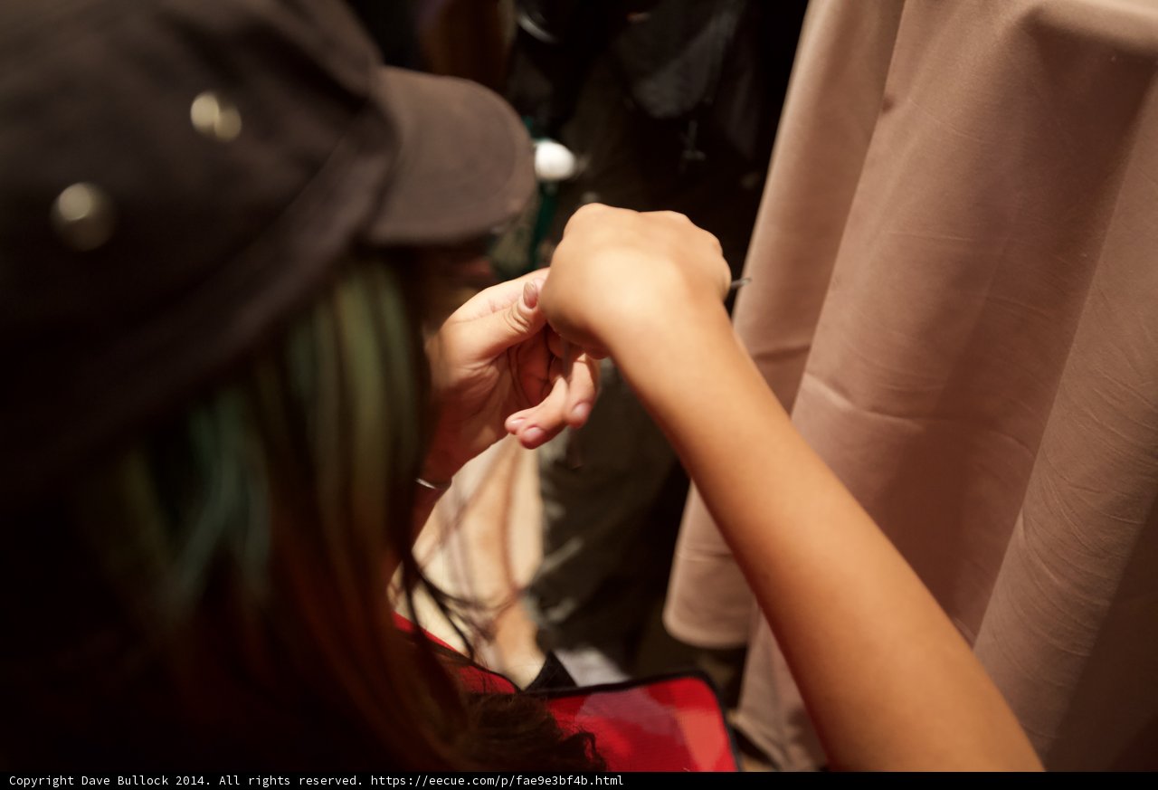 Green-haired Woman Puts on Hat in Las Vegas