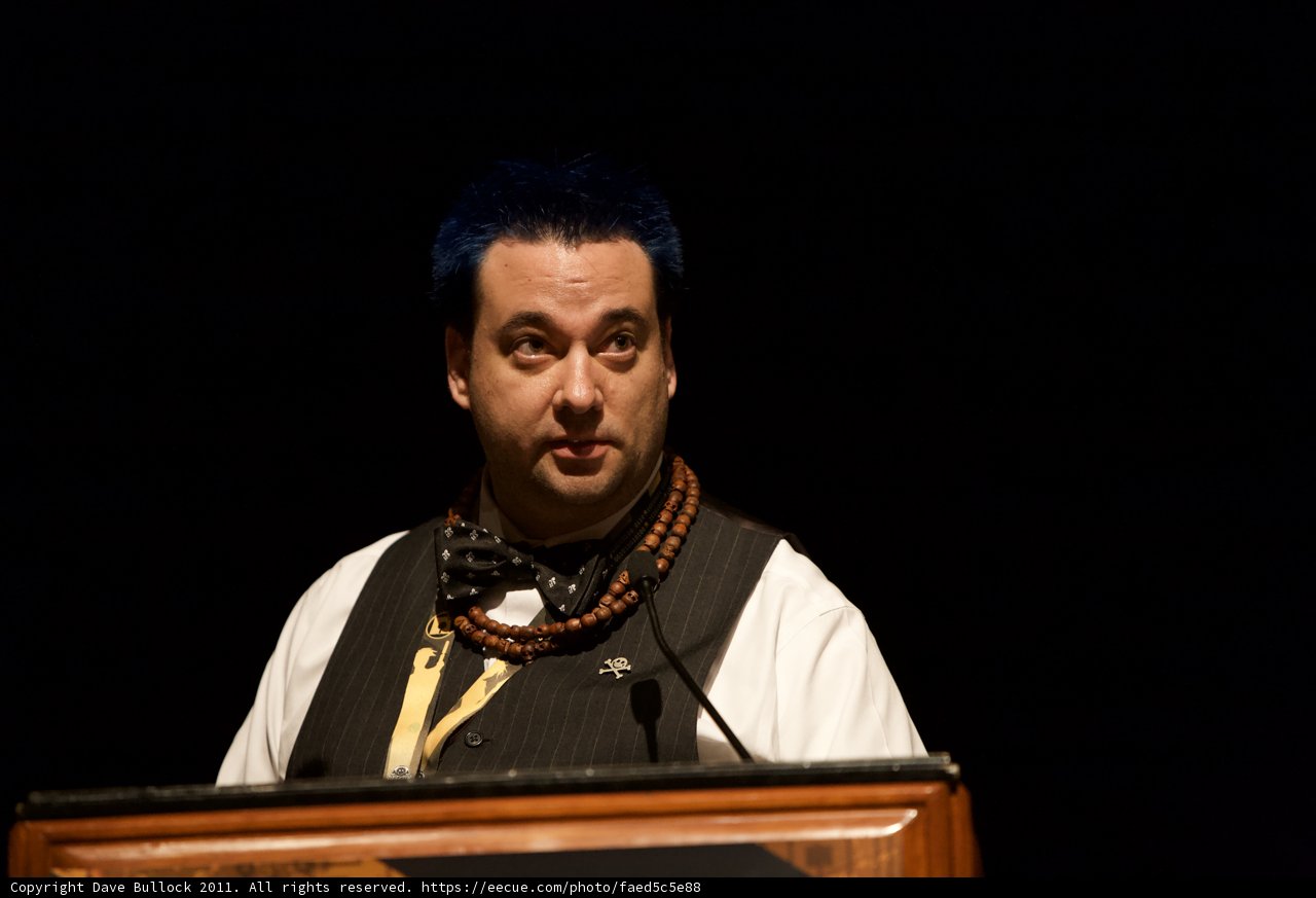 Blue-haired man delivers passionate speech