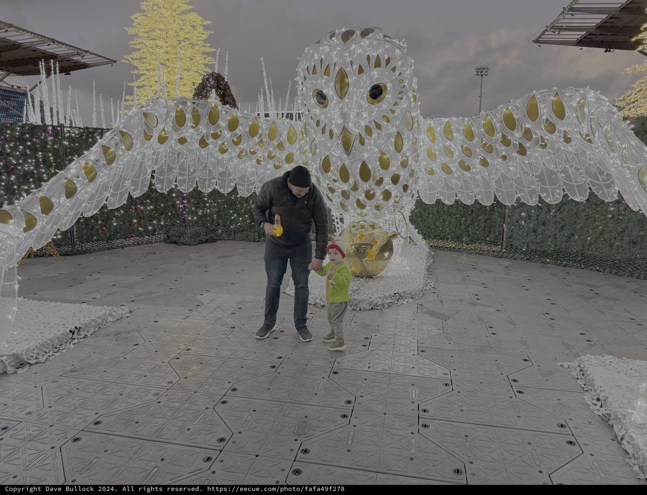 Father and Child at Giant Owl Installation