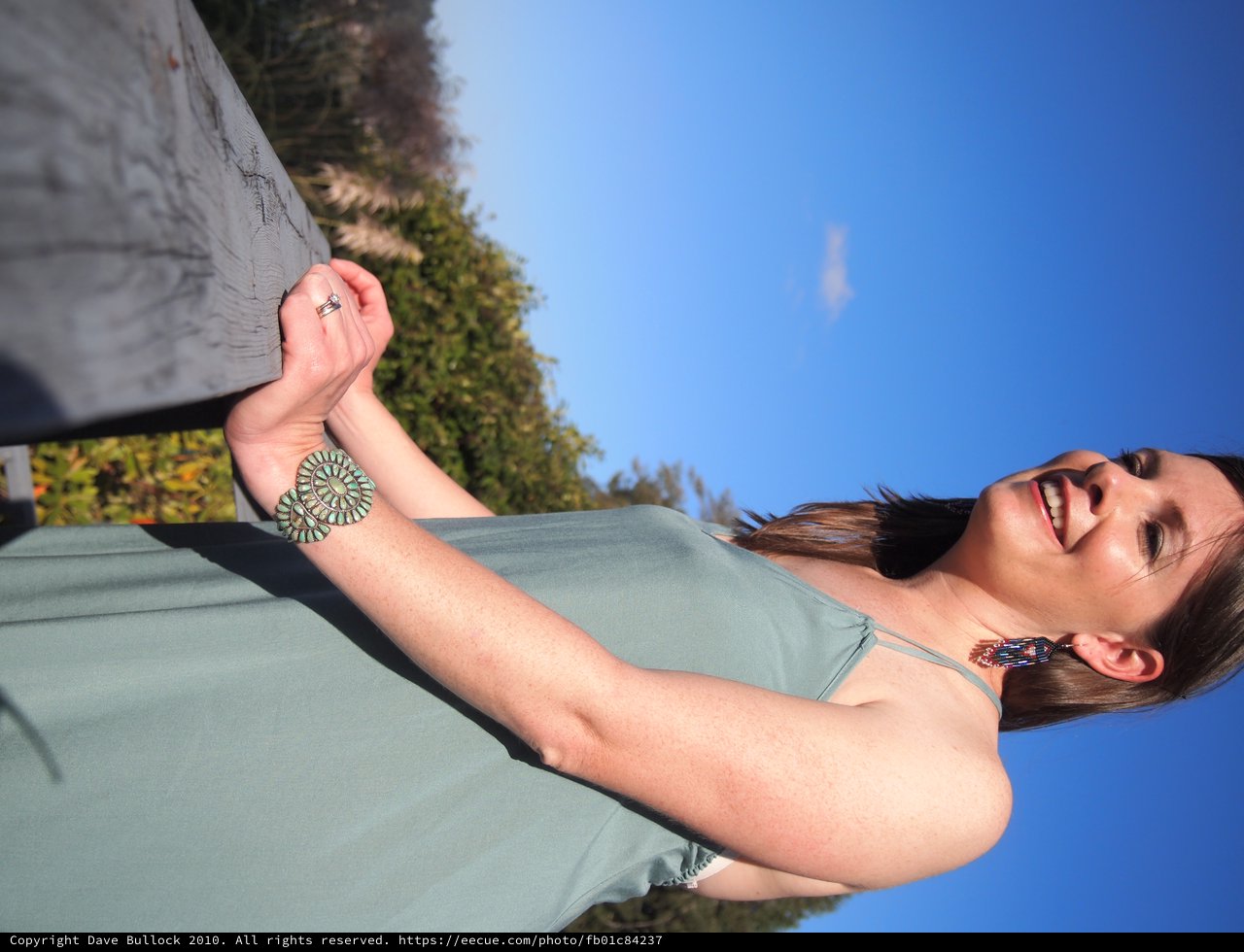 Joyful Woman in Turquoise Jewelry at Outdoor Wedding