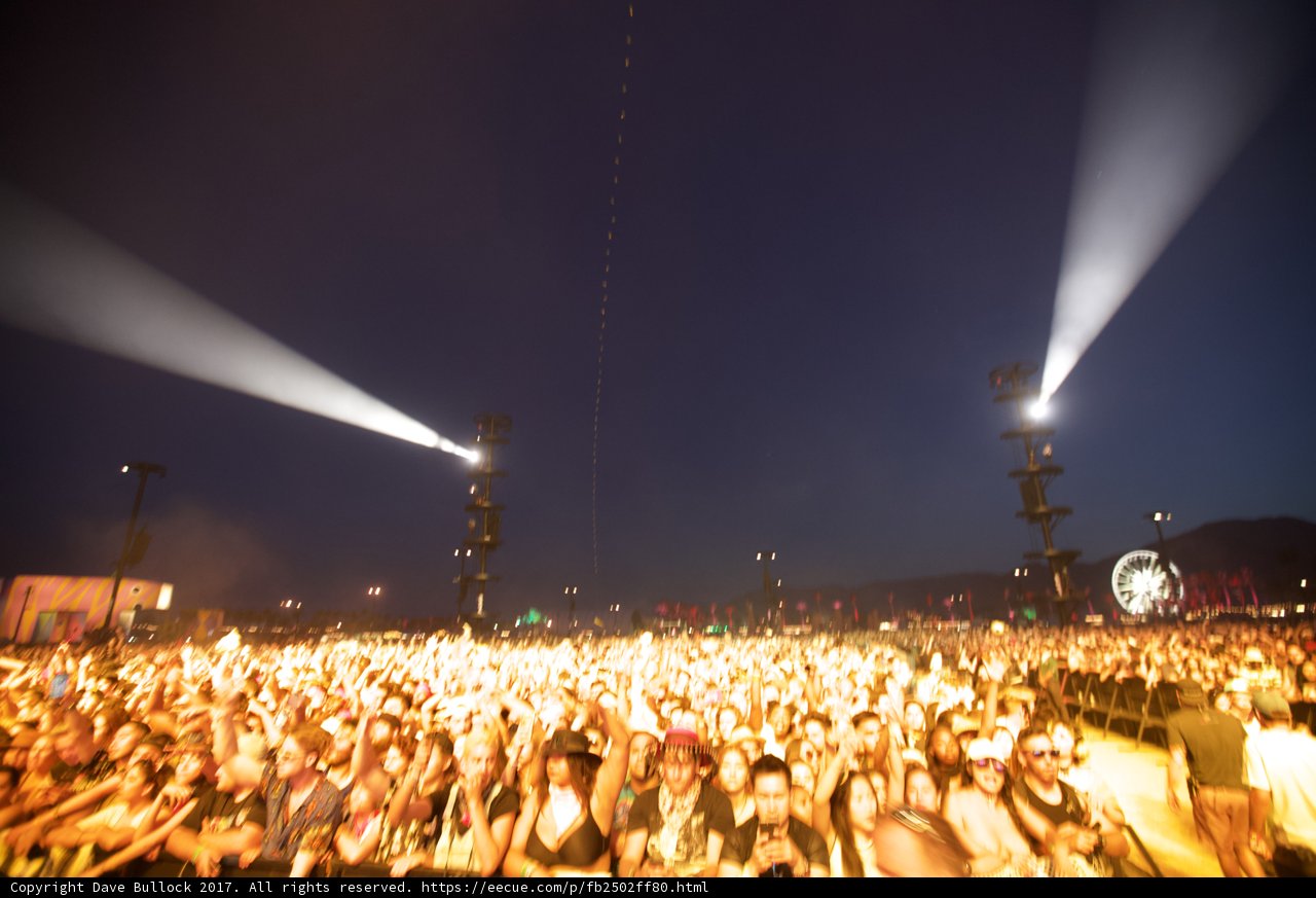 Illuminated Concert Crowd Under the Night Sky