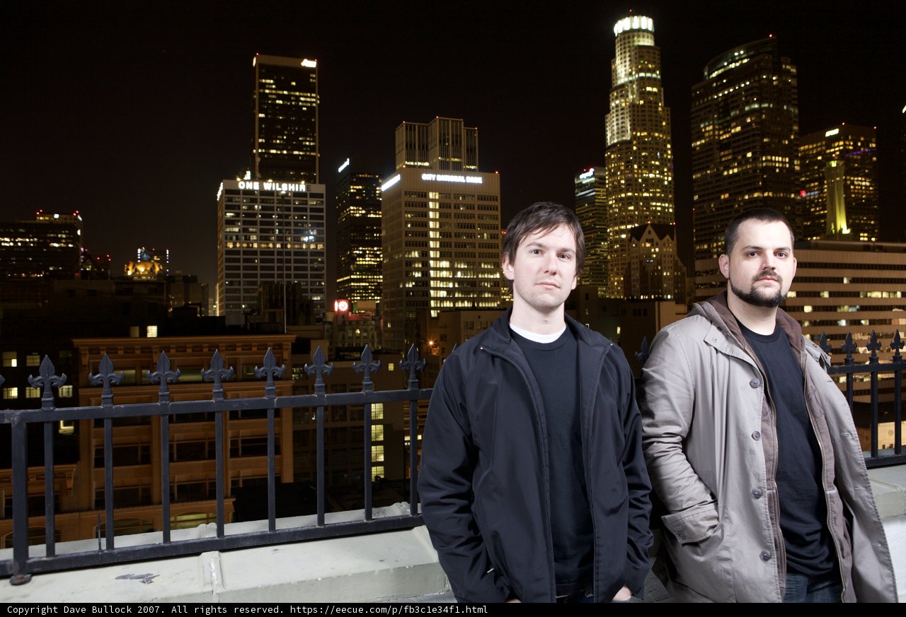 Two Men Enjoying the City Night View