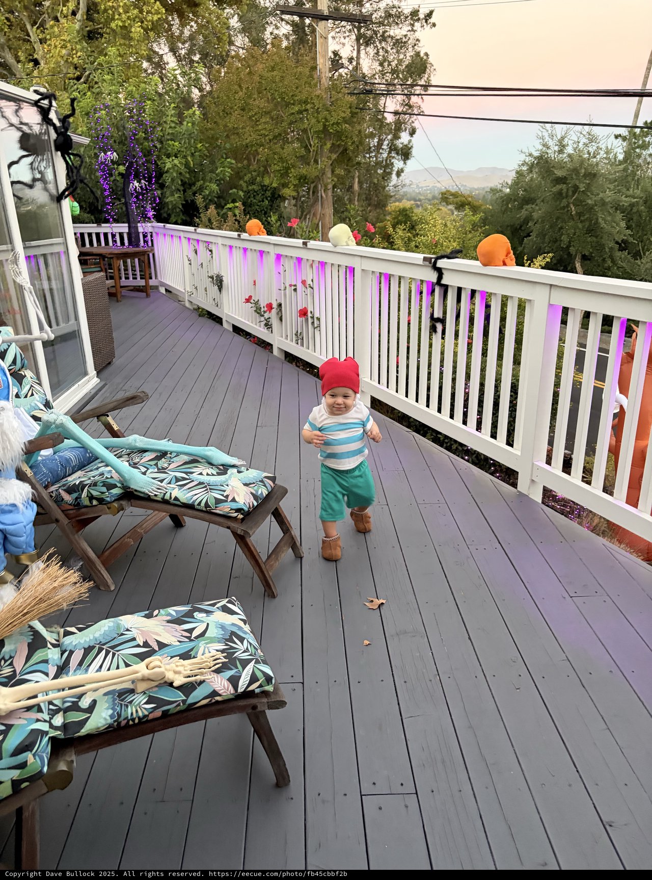 Toddler's Halloween Adventure on Decorated Deck