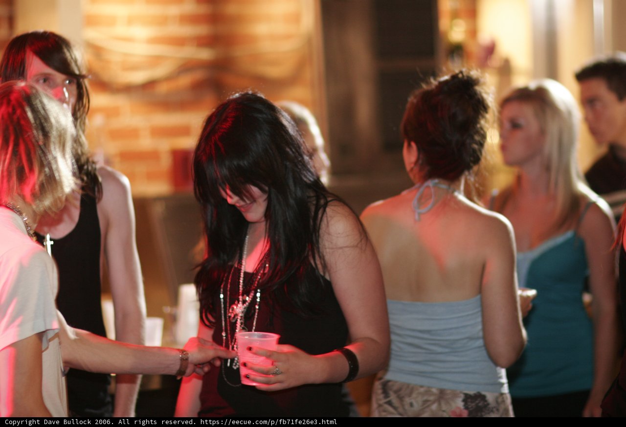 Night Club Gathering Caption: Nick Afanasiev and Jennifer Karnott join four women for a night of fun around a table at an urban night club.