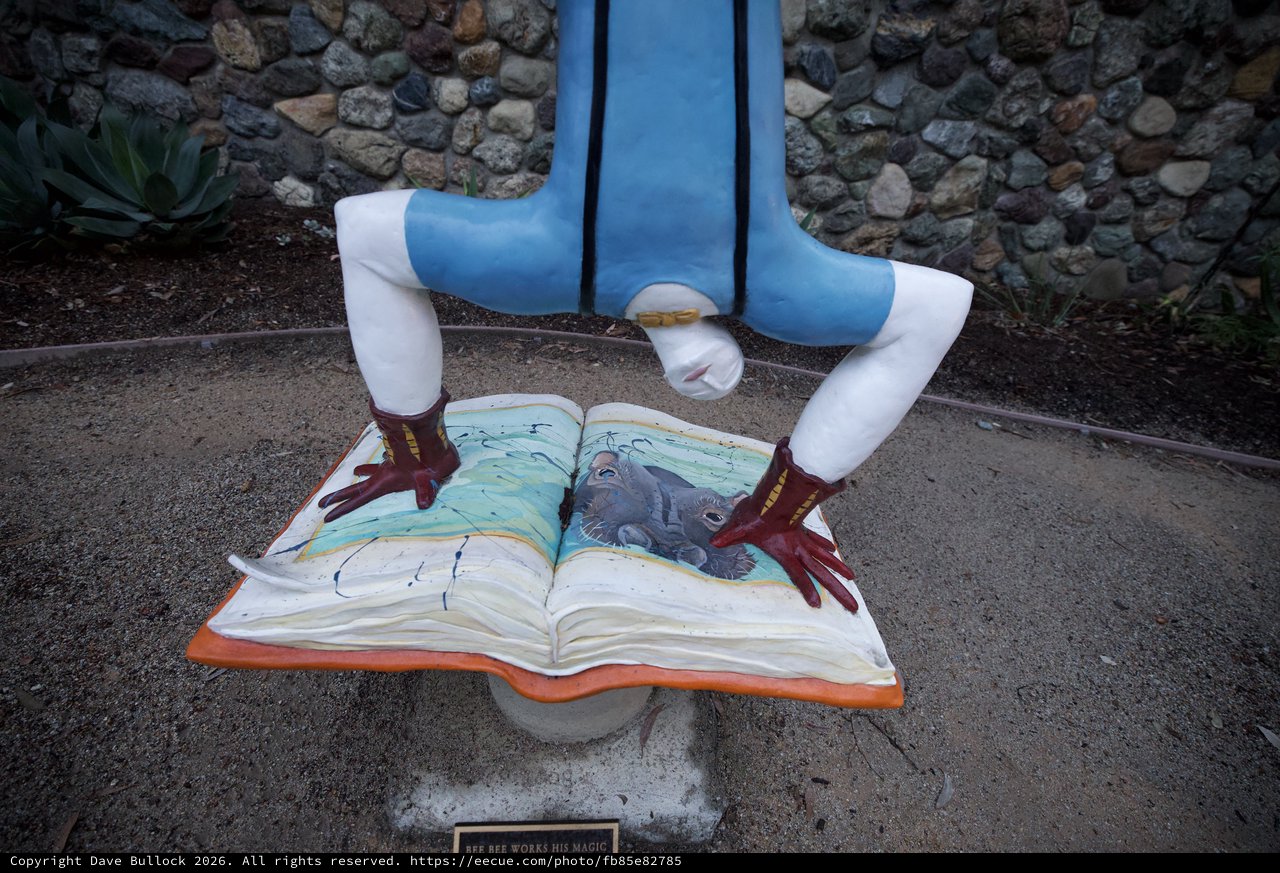 Whimsical Public Art: Reader Standing Over Open Book