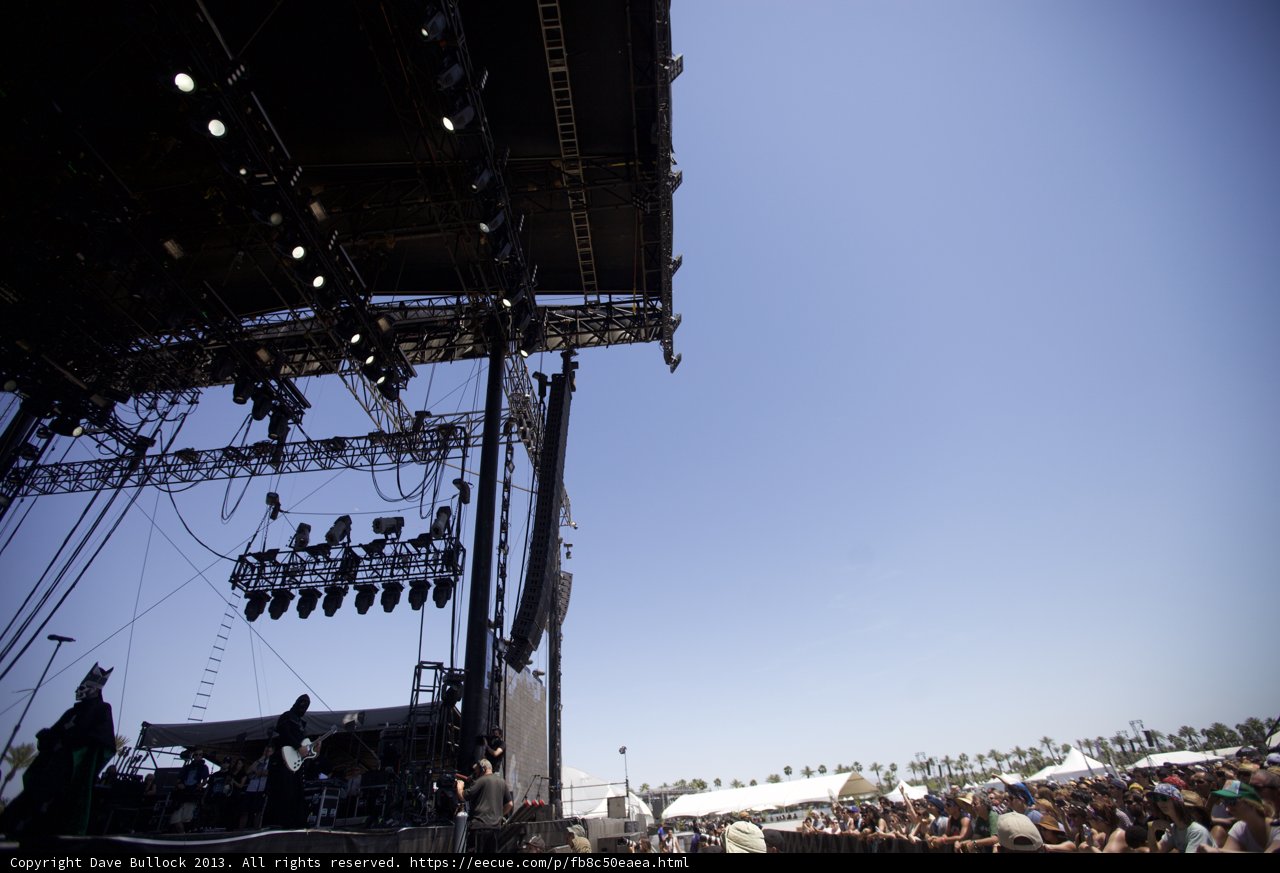 Concertgoers soak in the sun while watching their favorite performers