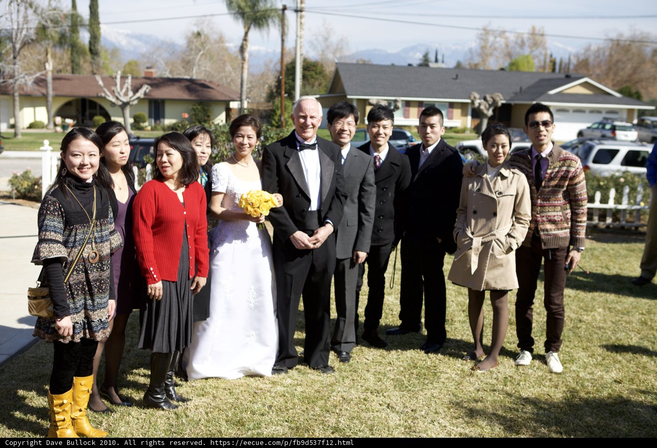 Wedding Party in Front of Grand Home