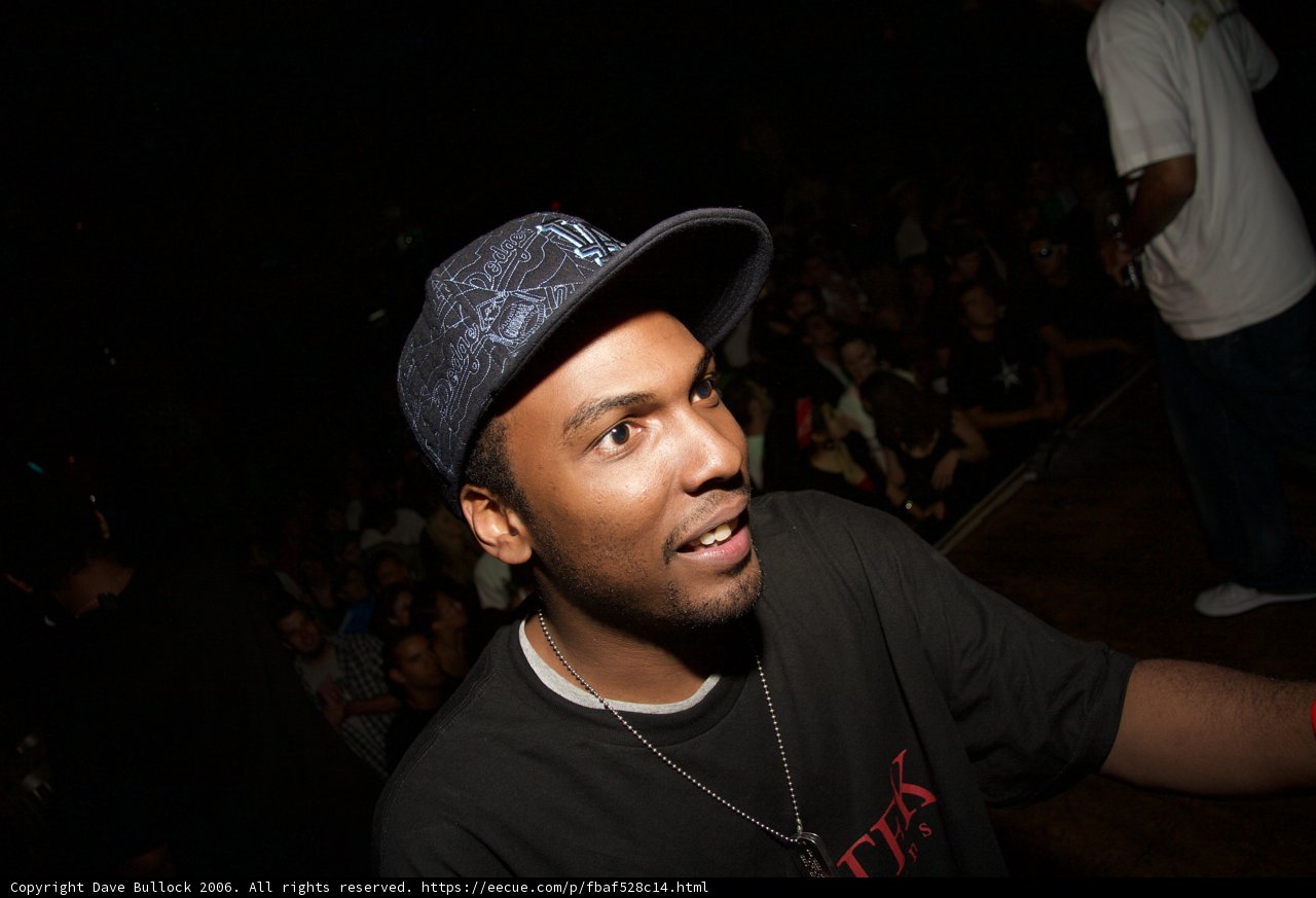 Man in Baseball Cap at Nightclub