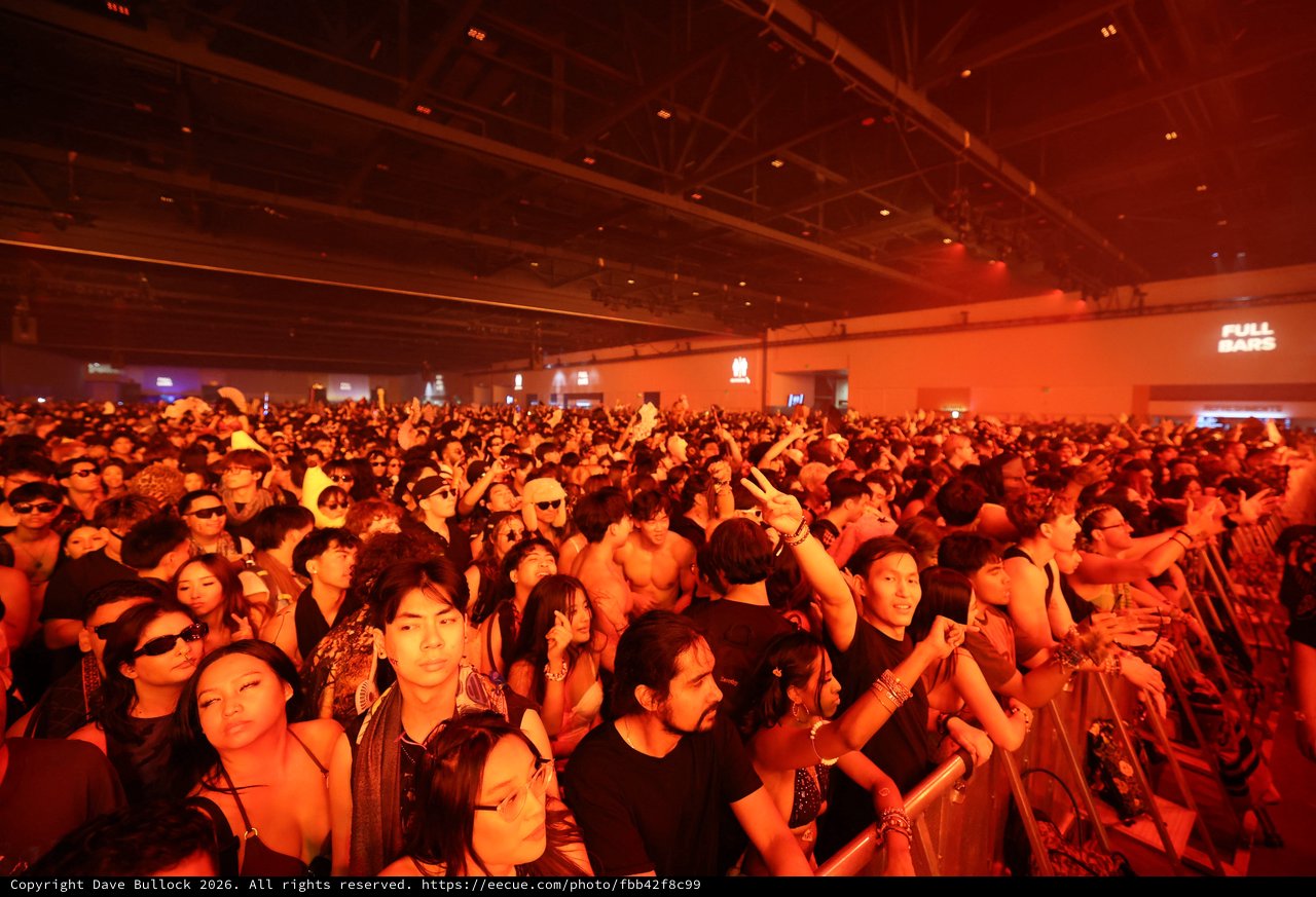 Massive Indoor Crowd Bathed in Red Light