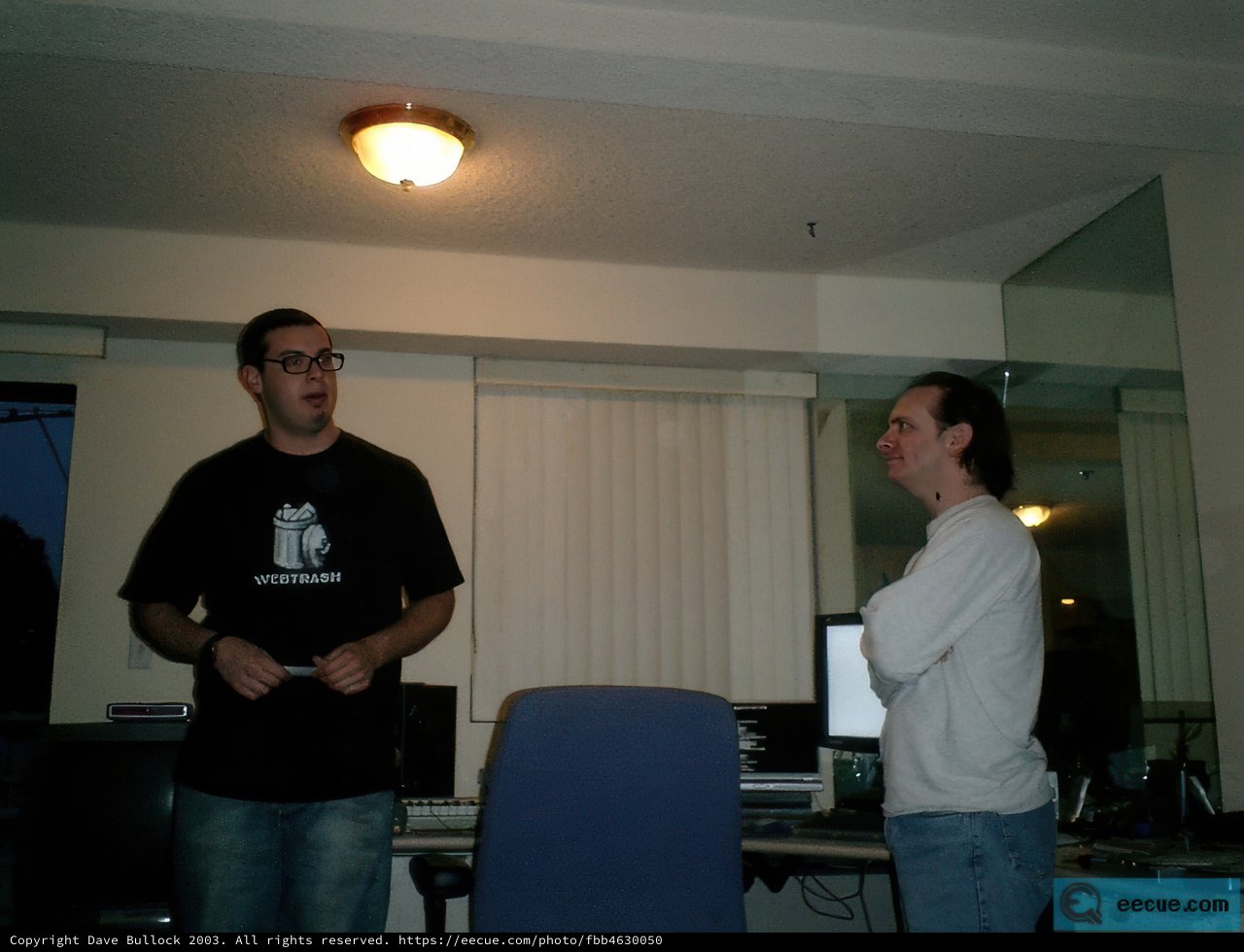 Two Men Discussing in a Well-Equipped Room