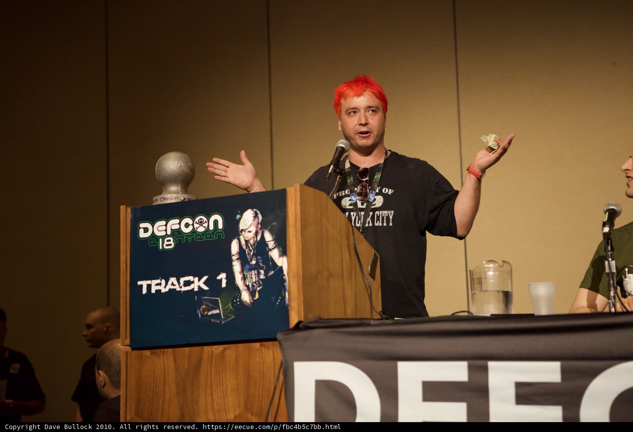 Red-Haired Man Addresses Crowd at Defcon 18 Podium