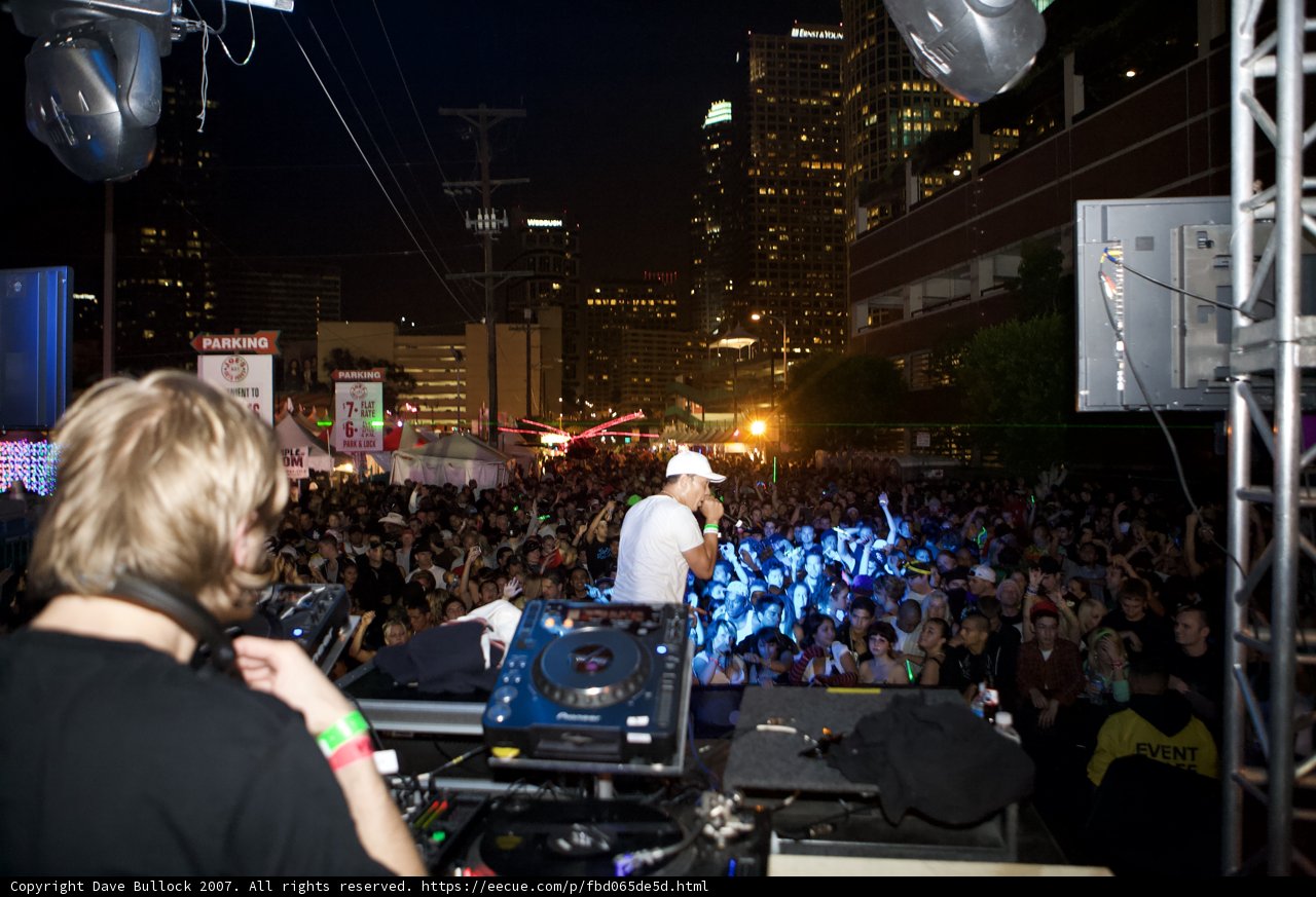 White Hat Musician Performing at Nocturnal Concert