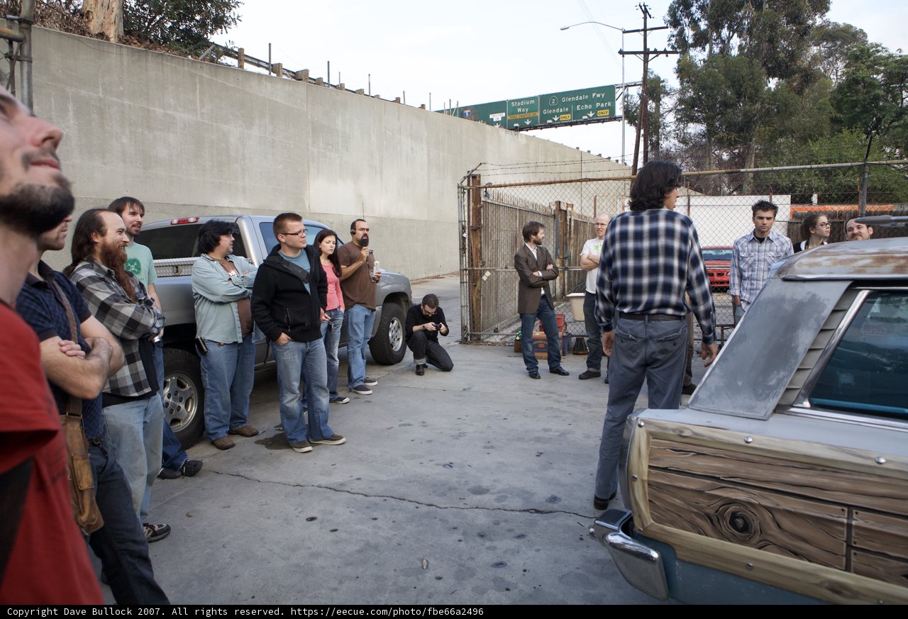 Group of people admiring vintage car