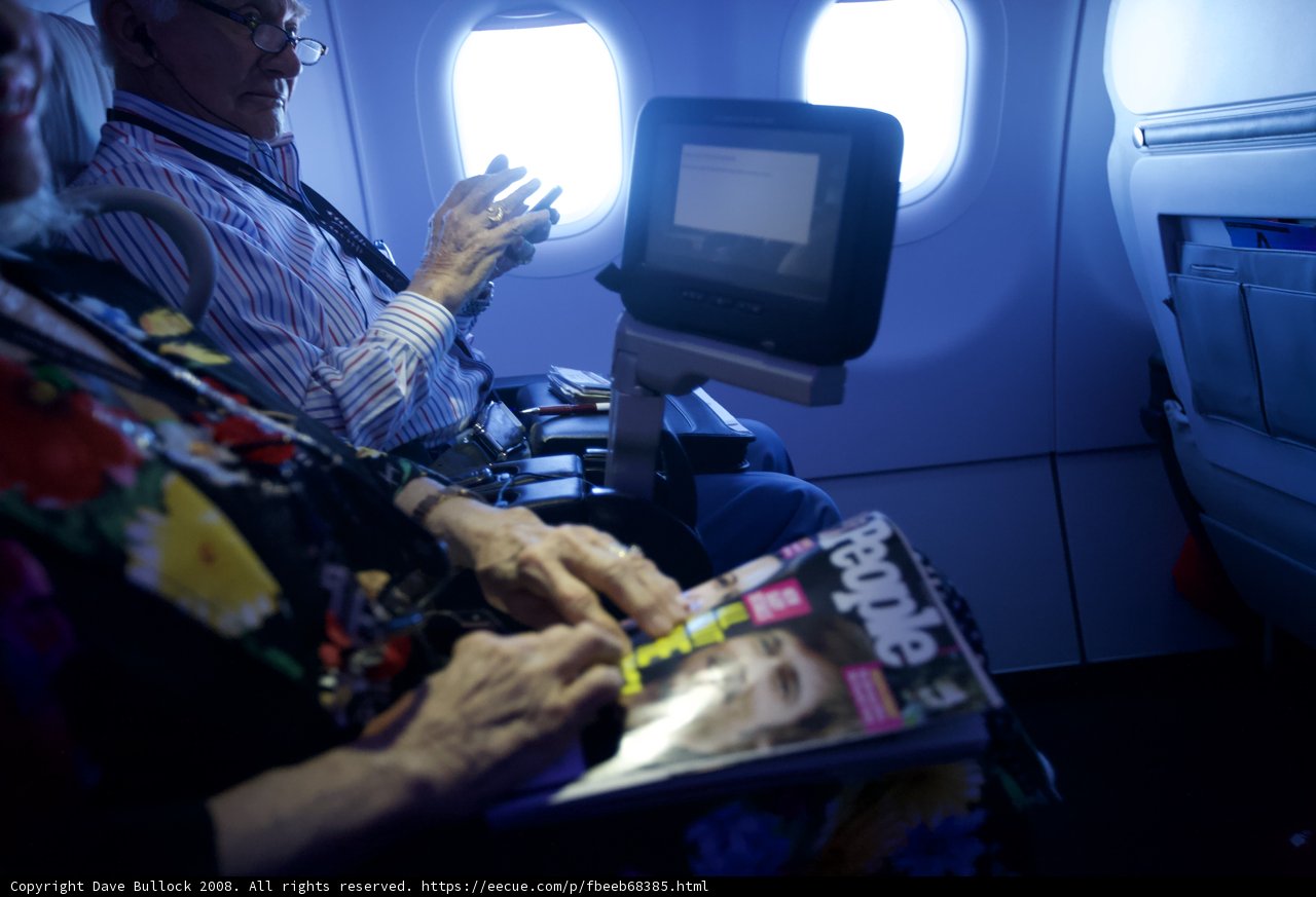 In-Flight Tech Savvy Couple