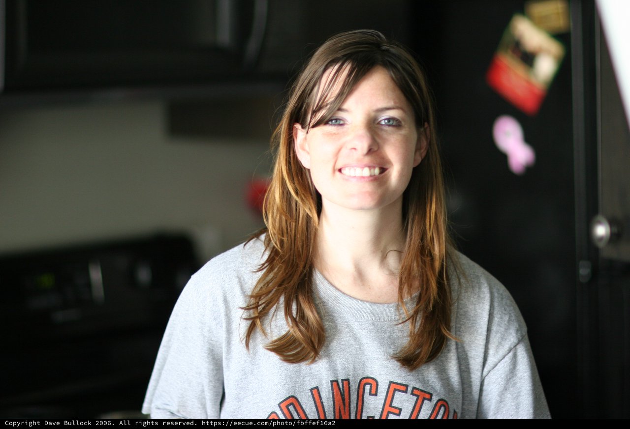 Smiling Woman in Princeton Sweatshirt at Home
